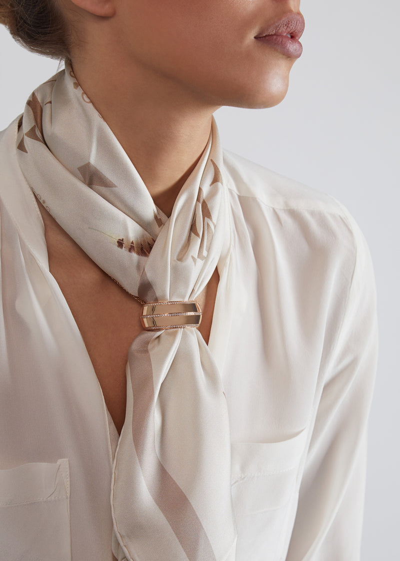 Tendance scarf necklace in 18 karat rose gold and diamonds. this scarf necklace is crafted in italy from 18 karat rose gold and white round cut diamonds. here worn with beige silk scarf