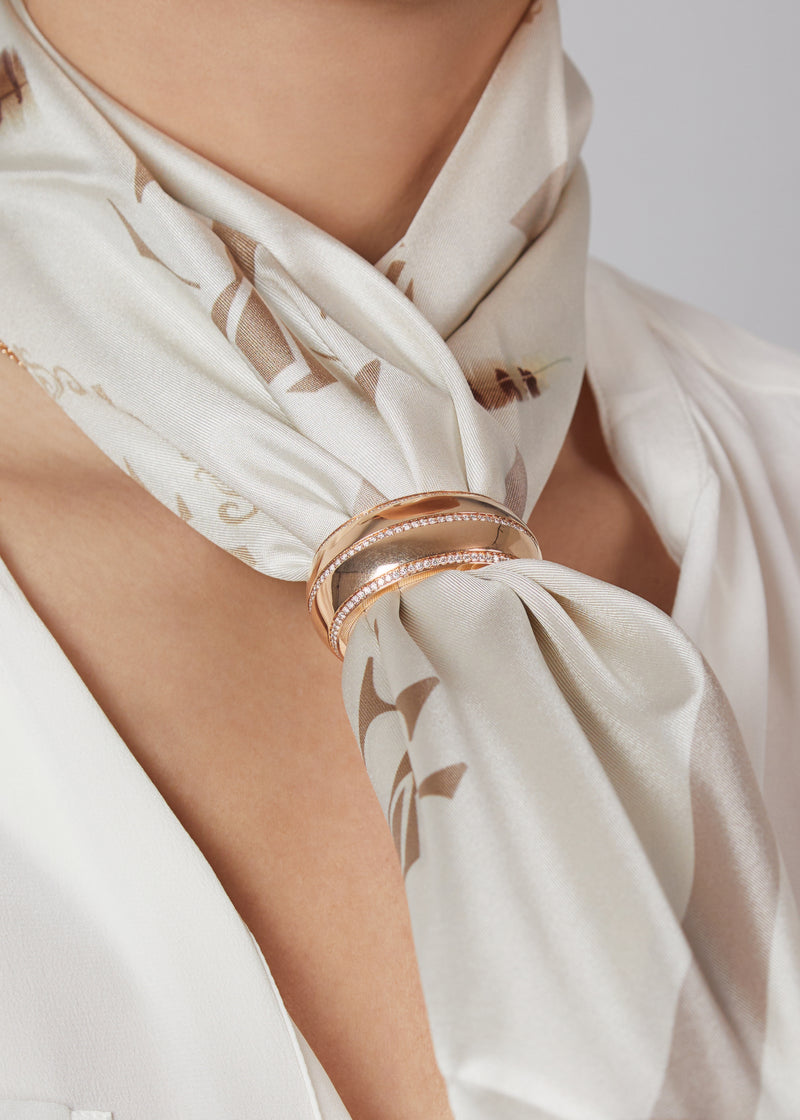 Tendance scarf ring in 18 karat rose gold and diamonds. this scarf ring is crafted in italy from 18 karat rose gold and white round cut diamonds. here worn with beige silk scarf